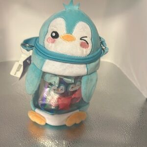 Claire’s Crossbody penguin. The inside is filled with six beautiful barrettes.